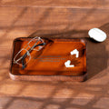 Personalized dark oak valet tray with camel leather and custom laser engraving for everyday essentials.