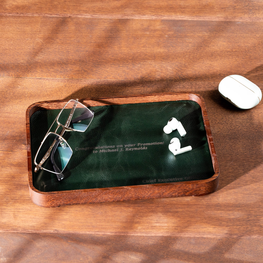 Personalized dark oak valet tray with green leather for watches, glasses, keys and everyday essentials.